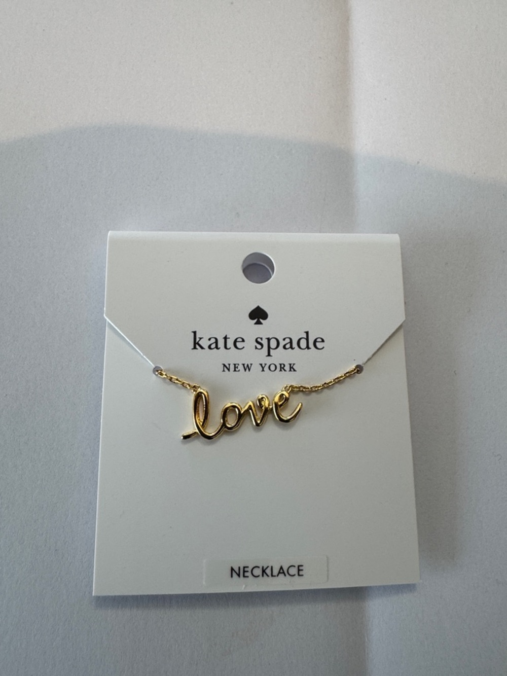 Brand new Kate Spade gold 'love' scripted pendant necklace